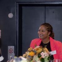 Two women talking together at the bar